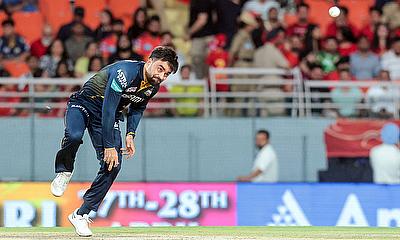 Gujarat Titans' Rashid Khan bowls a delivery during the IPL
