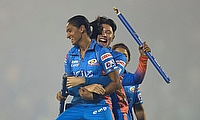 Mumbai Indians' Issy Wong lifts captain Harmanpreet Kaur after winning the (WPL)