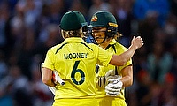 Australia's Beth Mooney and Georgia Wareham celebrate at the end of play