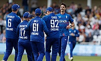 England's George Scrimshaw celebrates with teammates after taking the wicket of Ireland's Lorcan Tucker