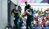 Australia's Marcus Stoinis celebrates with Matthew Wade after taking the wicket of England's Will Jacks