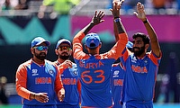 India's Jasprit Bumrah celebrates with team mates after taking the wicket of Pakistan's Babar Azam