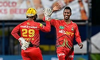 Akeal Hosein (R) and Nicholas Pooran (L) of Trinbago Knight Riders celebrate