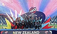 New Zealand players celebrate with the trophy after winning the Women's Cricket T20 World Cup