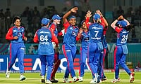 Delhi Capitals' Shikha Pandey celebrates with teammates