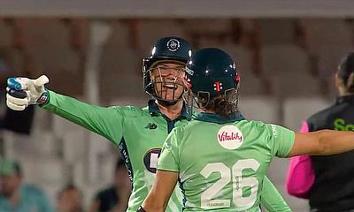 Lauren Winfield-Hill and Alice Capsey celebrate a 9 wicket win