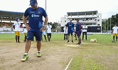 Bangladesh's Russell Domingo inspects the pitch