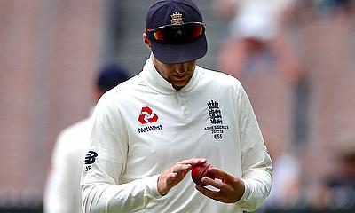 England's captain Joe Root rubs the ball