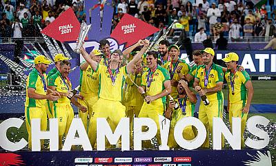 Australia captain Aaron Finch celebrates with the trophy and teammates after winning the ICC Men's T20 World Cup