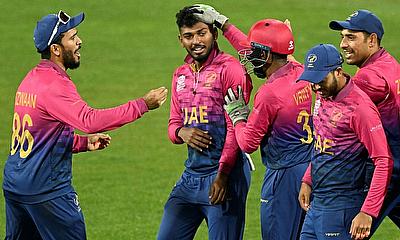 Karthik Meiyappan (2nd R) celebrates a wicket against Sri Lanka