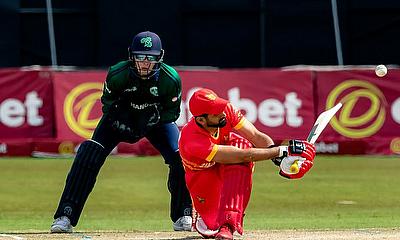 Zimbabwe star Sikandar Raza (R) plays a shot during the first one-day international against Ireland in Harare