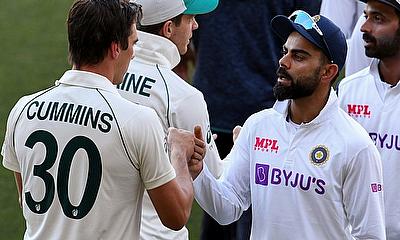 India's Virat Kohli congratulates Australia's Pat Cummins