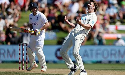 New Zealand's Blair Tickner (R) celebrates his wicket of England's Harry Brook (L) during day three of the first Test at Bay Oval