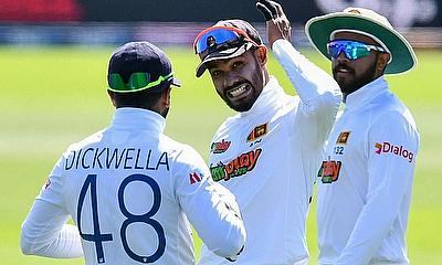 Sri Lanka's Dhananjaya de Silva (C) shares a light moment with teammates Niroshan Dickewella (L) and Kusal Mendis