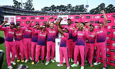 South Africa's Temba Bavuma celebrate with a trophy and teammates