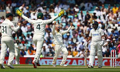 Australia's Nathan Lyon celebrates after taking the wicket of India's Mohammed Siraj to win the World Test Championship final