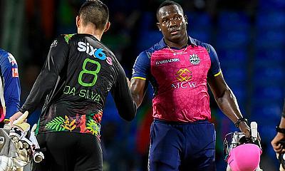 Joshua Da Silva (L) of Saint Kitts and Nevis Patriots congratulate Rovman Powell (R)