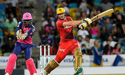 Martin Guptill (R) of Trinbago Knight Riders hits 4 and Kevin Wickham (L) of Barbados Royals