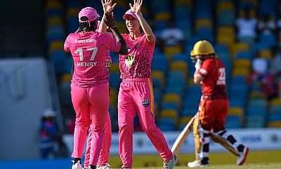 Erin Burns (2L) of Barbados Royals celebrates the dismissal of Mignon Du Preez