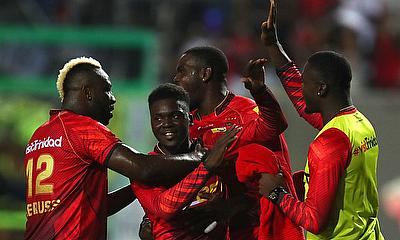 Jaden Carmichael (C) of Trinbago Knight Riders celebrates with teammates