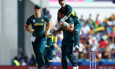 Australia's Marcus Stoinis celebrates with Matthew Wade after taking the wicket of England's Will Jacks