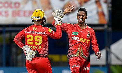 Akeal Hosein (R) and Nicholas Pooran (L) of Trinbago Knight Riders celebrate