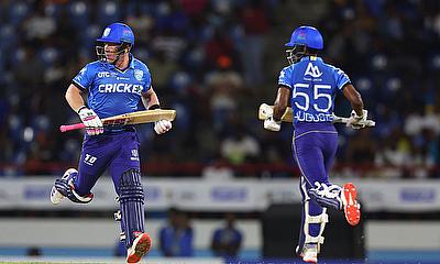 Tim Seifert (L) and Ackeem Auguste (R) of St Lucia Kings run between the wickets