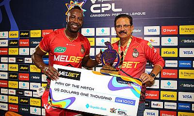 Man of the Match Andre Russell of Trinbago Knight Riders collects his awards from Venky Mysore