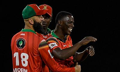 Shamar Joseph (R) and Moeen Ali (L) of Guyana Amazon Warriors celebrate