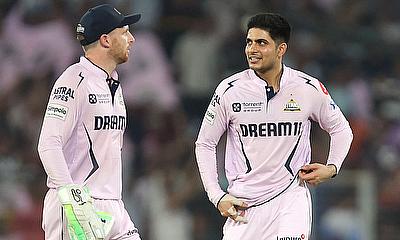 Gujarat Titans' Shubman Gill interacts with Jos Buttler Gujarat Titans' Shubman Gill interacts with Jos Buttler