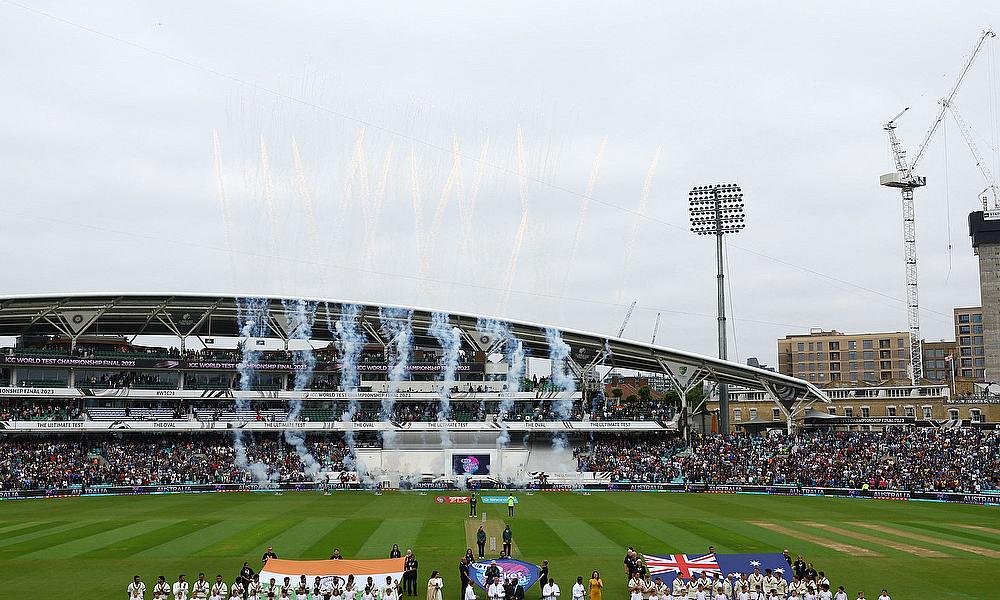 India and Australia players line up during the national anthems before the match