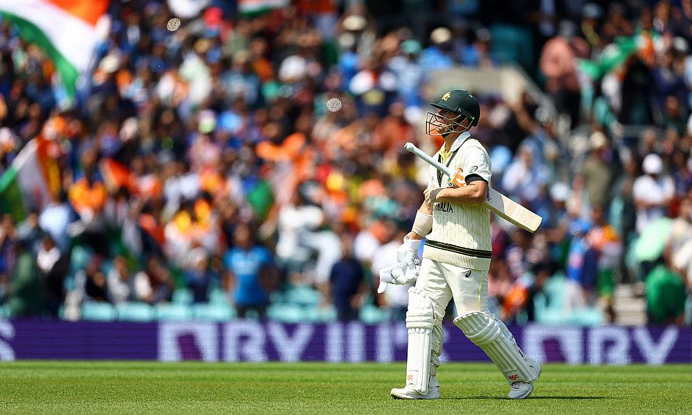 Australia's David Warner walks after losing his wicket