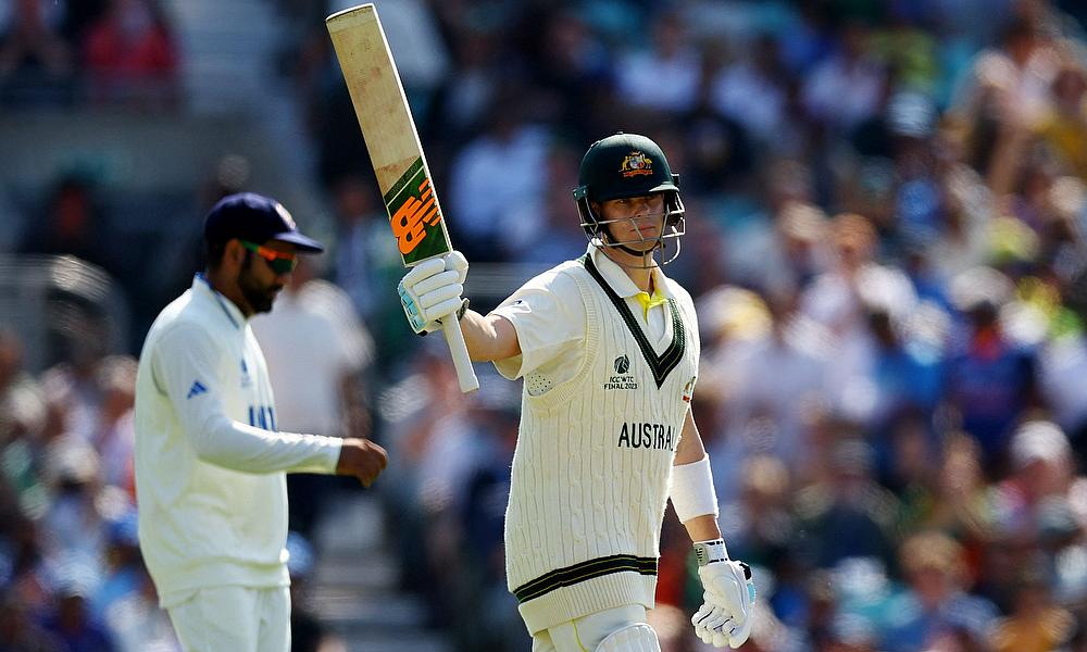 Australia's Steven Smith celebrates reaching his half century