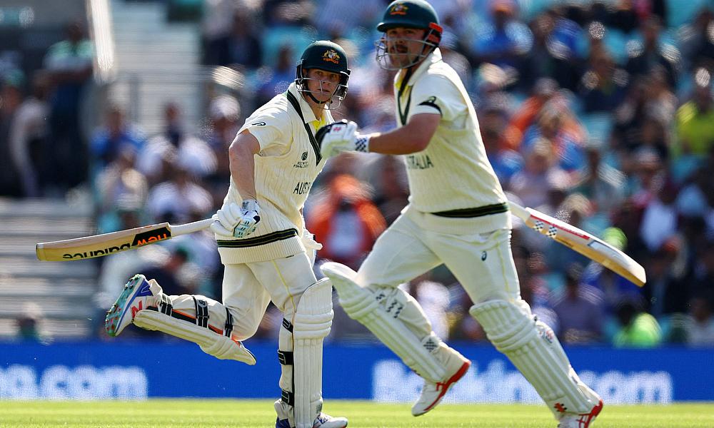 Australia's Travis Head and Steven Smith in action