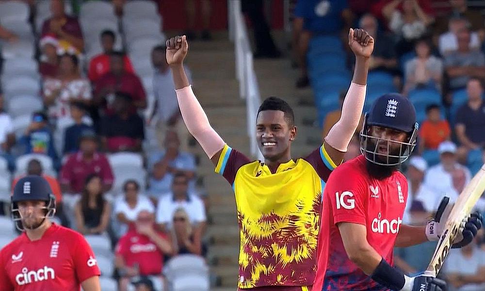 Akeal Hosein celebrates the wicket of Moeen Ali