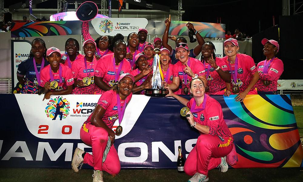 The Barbados Royals celebrate pose for a photo with the Massy Women's Caribbean Premier League trophy