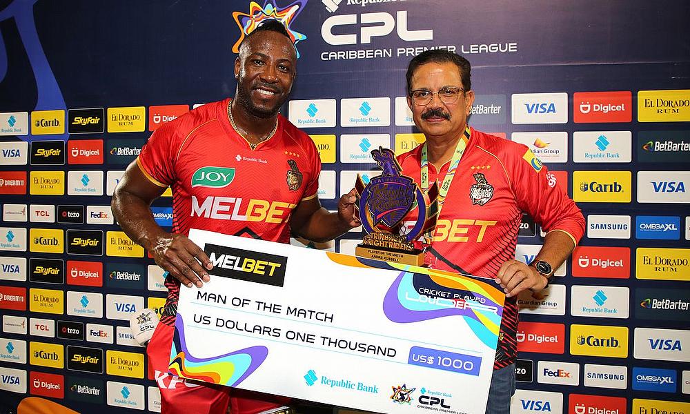 Man of the Match Andre Russell of Trinbago Knight Riders collects his awards from Venky Mysore