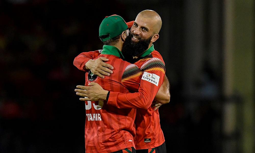 Moeen Ali (R) and Imran Tahir (L) of Guyana Amazon Warriors celebrate